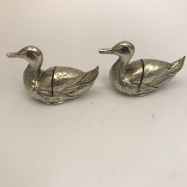 Two small Silver matching menu holders in the form of ducks