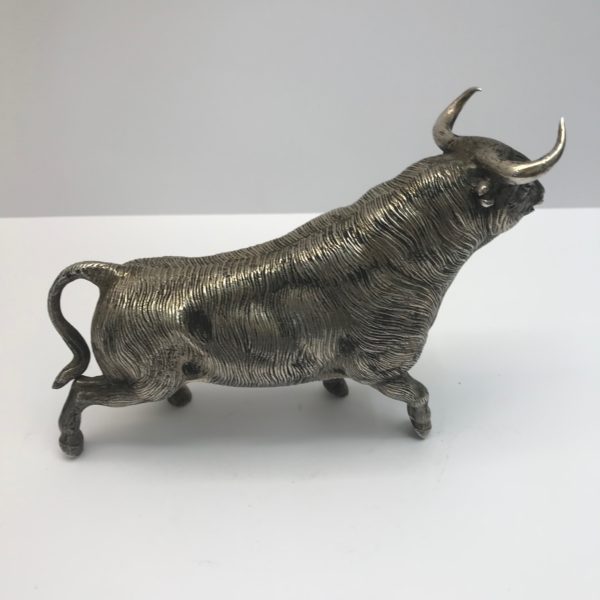A Realistic Silver plated model of a bull,